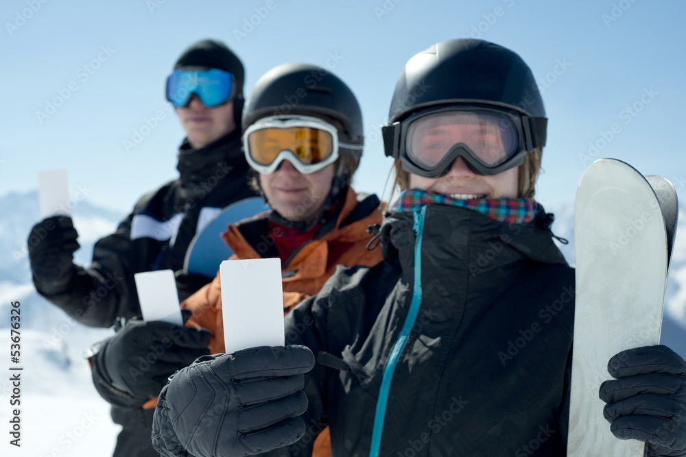 skiers holding Ikon Pass - Deer Valley