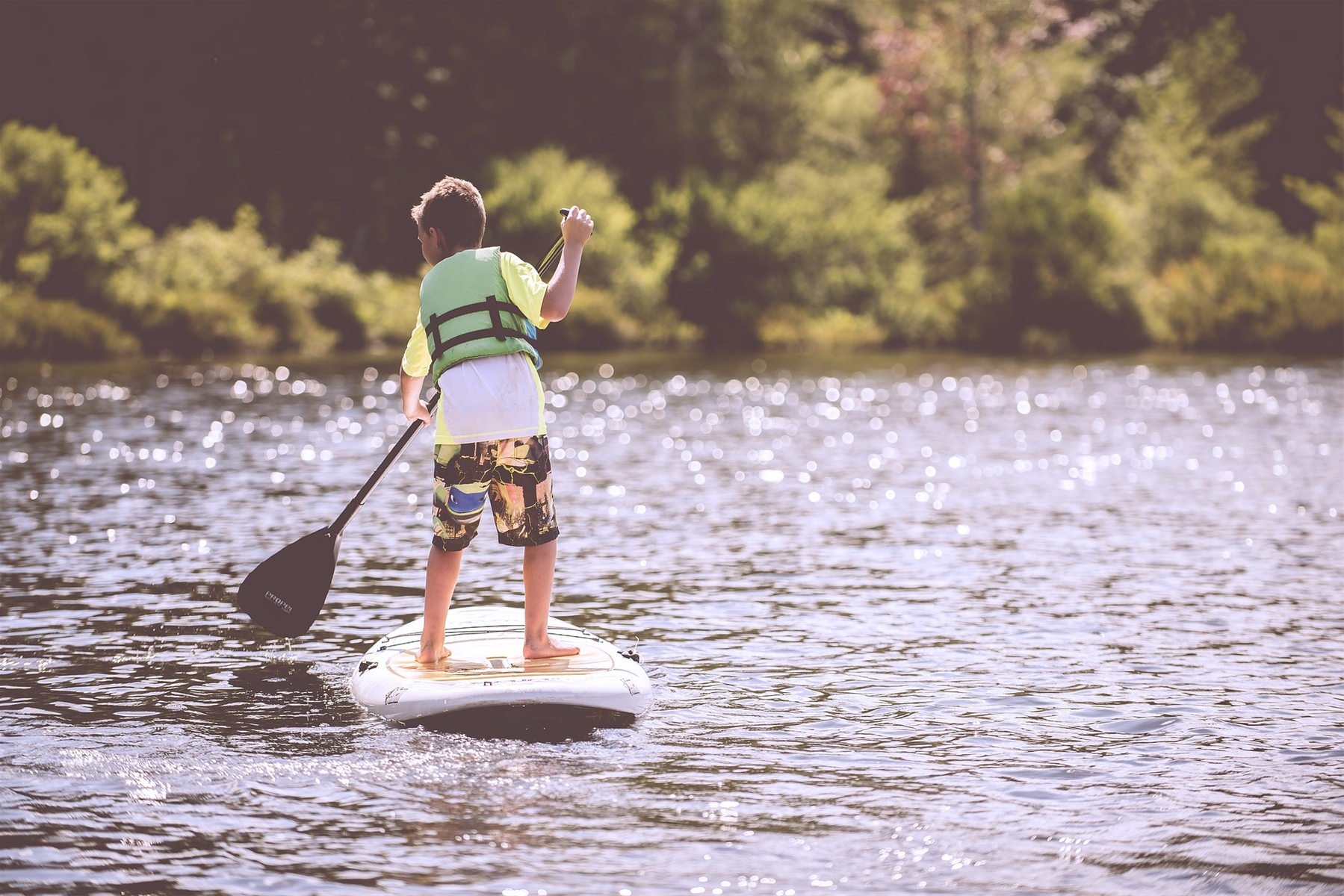 Boy using a Paddle Board