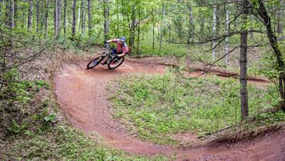 Person Riding Mountain Bike in Park City