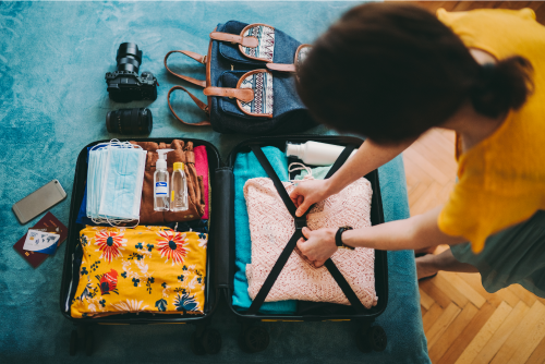 Women Packing Her Suitcase For Vacation