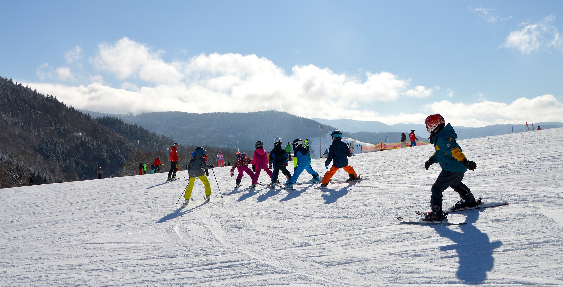 Kids in Ski School Skiing on Mountain