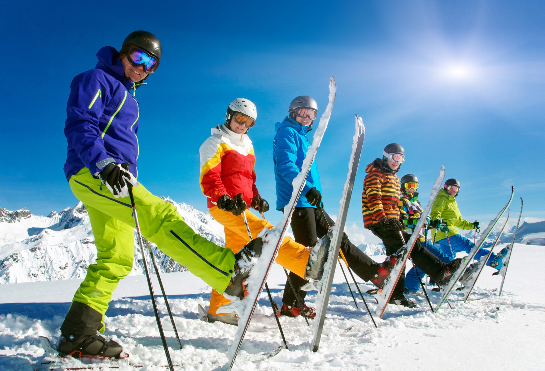 6 People Holding there Skis Up